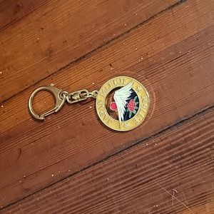 Keychain, gold-plated, color golden, white, red and green.